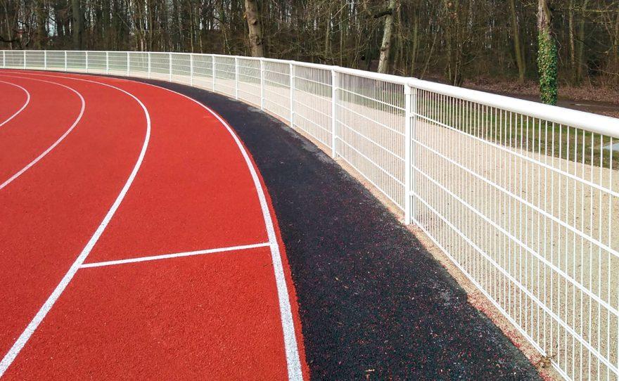 Welded mesh handrail with anti-noise system dB Lock on an athletics field